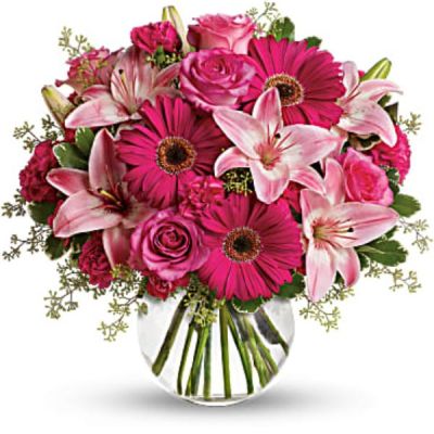 Sometimes all you need is a little pink me up! An ideal pick for anyone whose favorite color is pink, this stylish mix is full of variety and comes presented in a clear glass bubble bowl they'll use again and again.
A wide variety of flowers including pink roses, pink asiatic lilies, hot pink gerberas, pink carnations and hot pink miniature carnations are mixed with fresh variegated pittosporum and seeded eucalyptus.